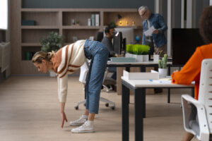 woman office stretching work day